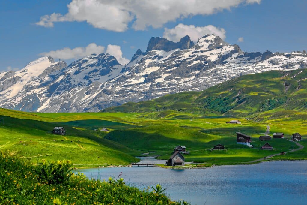 Mountain landscape in summer in Switzerland, with a peaceful lake.