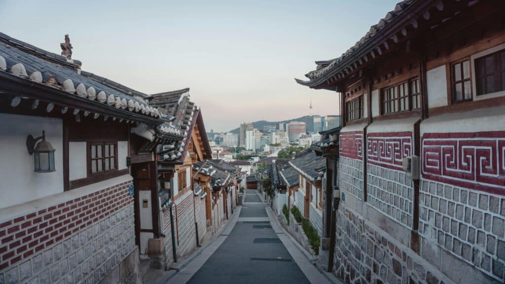 View of a long street in Seoul's traditional village district, with the buildings in the background, reflecting the contrast between modernity and tradition in South Korea's capital.