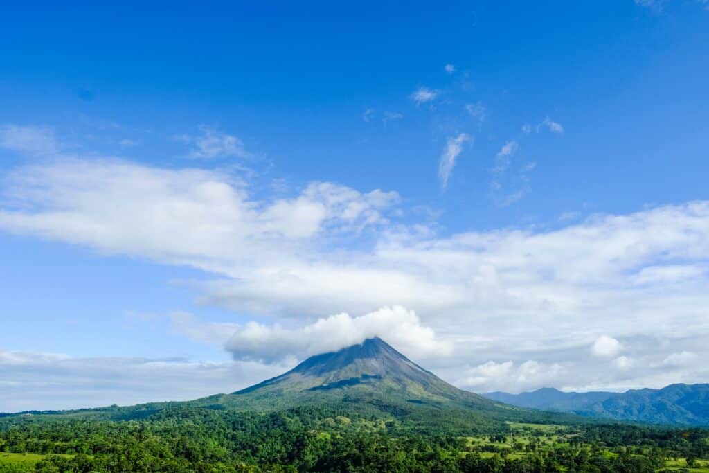 Costa Rica's dormant volcano, overlooking a vast green rainforest.