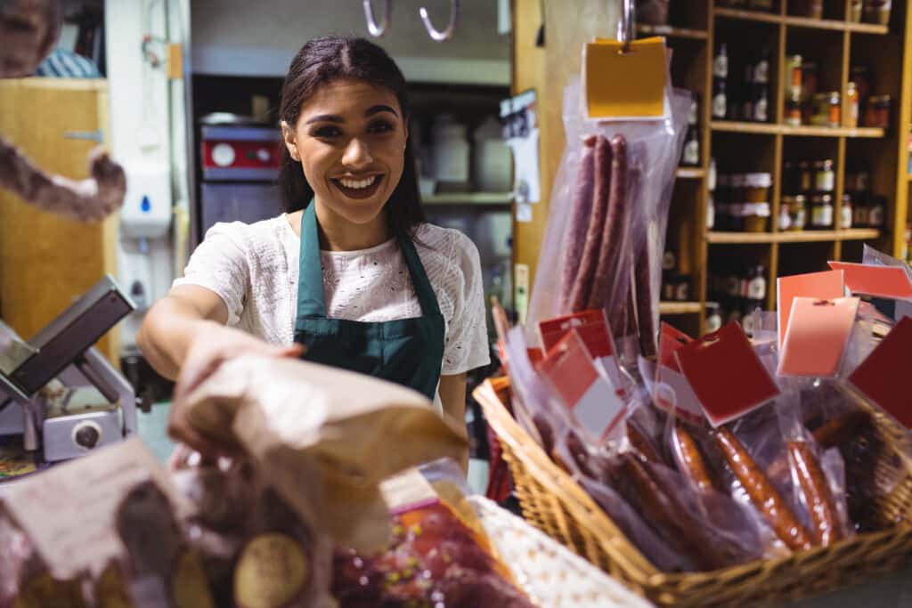 Chilean woman working at a butcher's counter in a market