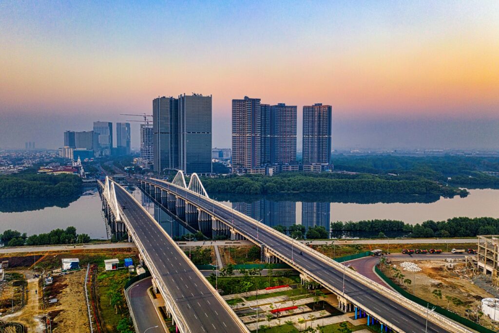 The photo shows Jakarta's main roads, two large bridges spanning a river and leading to the business district.