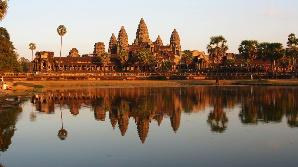 The temple of Angkor wat in Krong siem reap, Cambodia, in front of a lake. The picture has been taken during the sunset time.