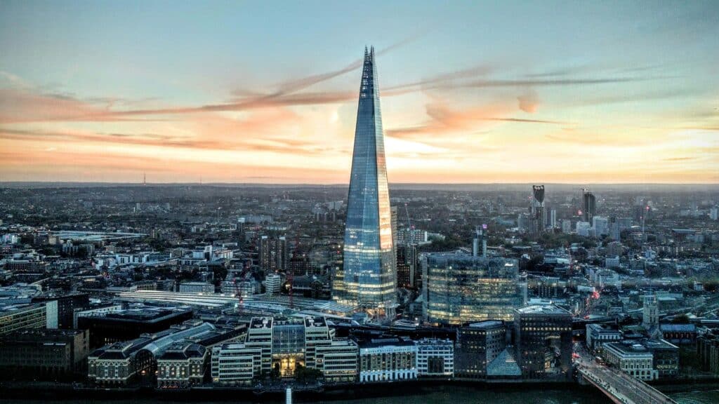 Aerial photo of the Shard, the famous skyscraper in London in the United Kingdom, and the surrounding urban landscape.