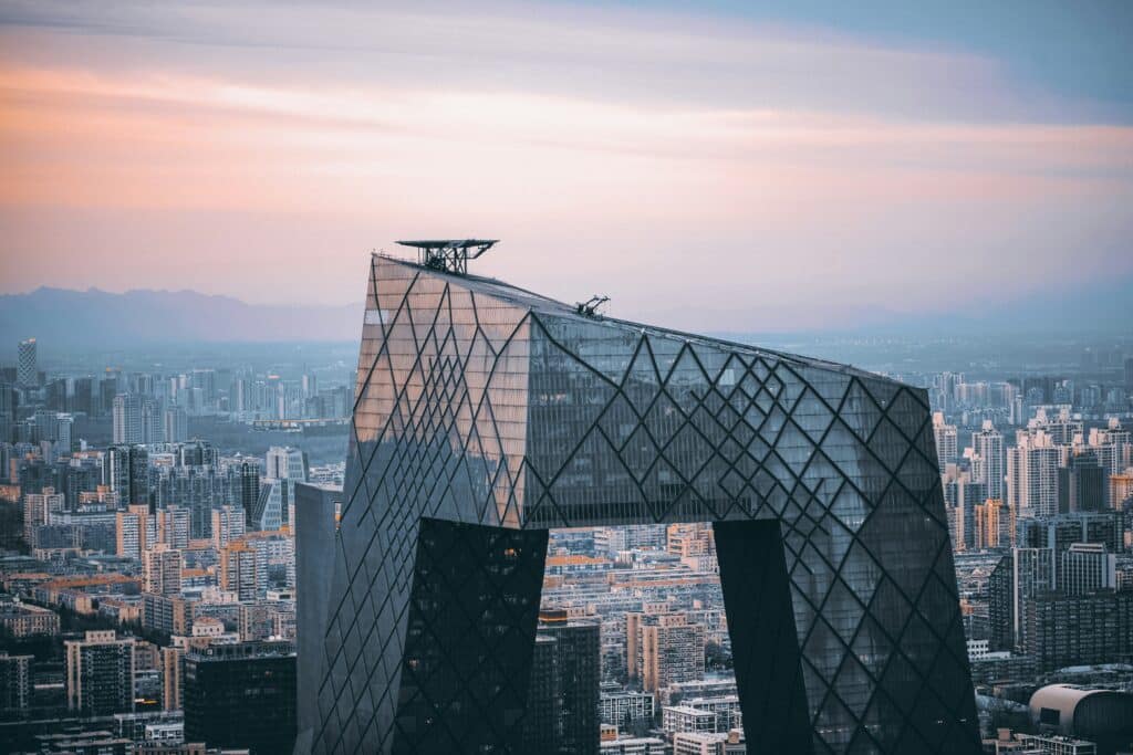 Aerial photo of the CTTV offices in Beijing, China, taken at sunset. The rest of the city can be seen in the background.