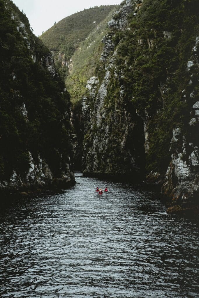 People canoeing in the mountain gorges of the Tsitsikamma National Park in South Africa.